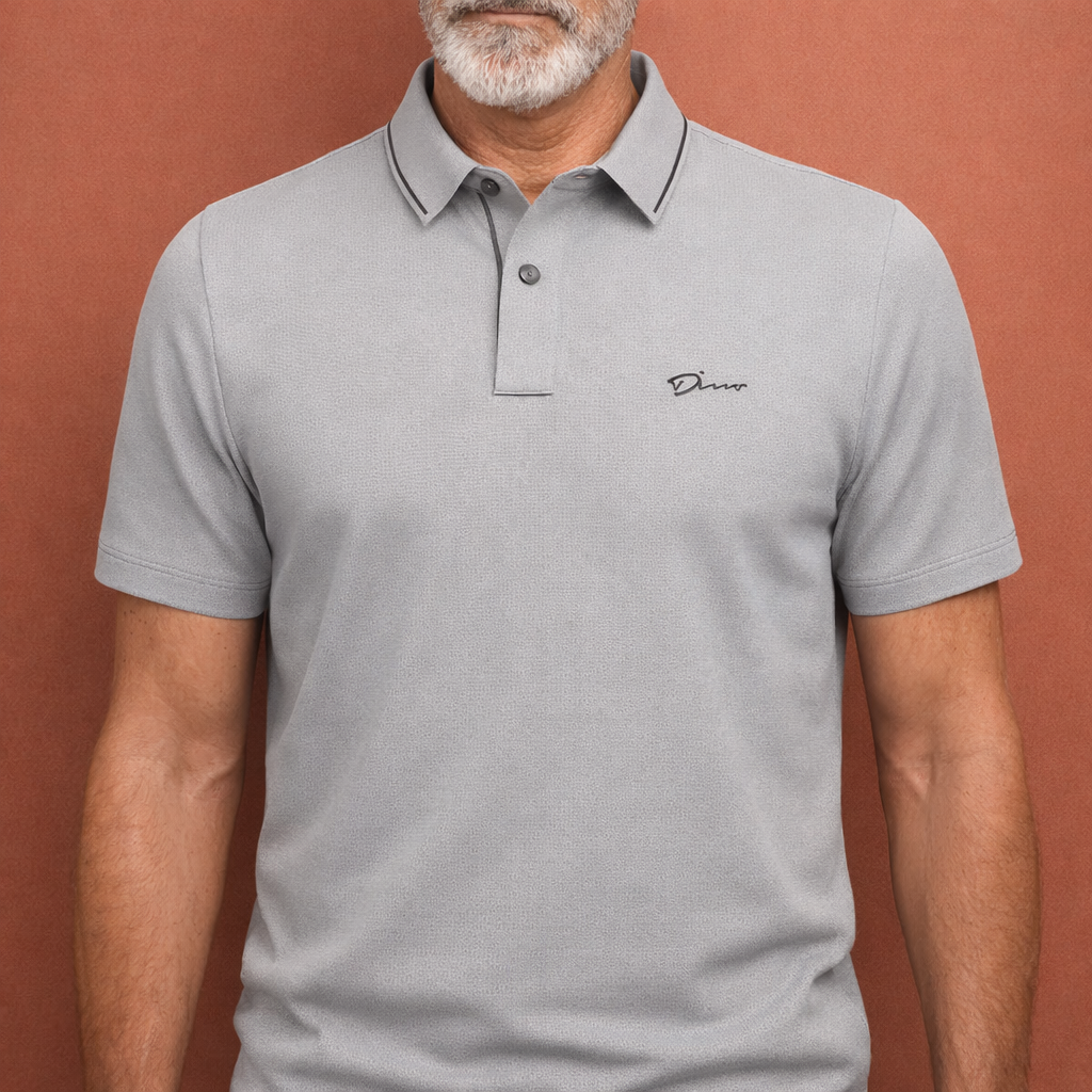 Heren polo in grijs met minimalistisch design, zacht en comfortabel voor casual en stijlvolle outfits.