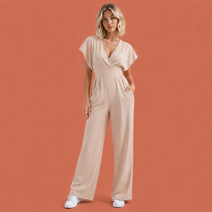 Dames jumpsuit in beige met ruchemouwen, zacht en comfortabel voor casual en stijlvolle outfits.