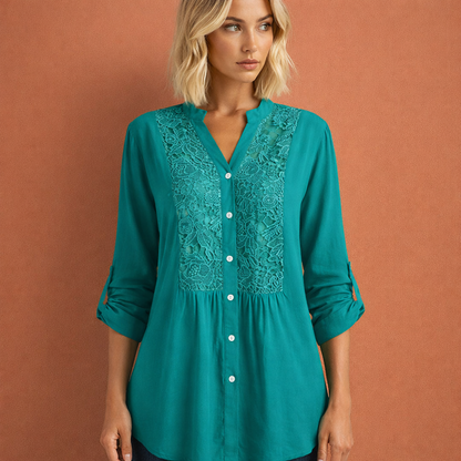 Dames tuniekblouse in blauwgroen met minimalistisch design, zacht en comfortabel voor casual en stijlvolle outfits.
