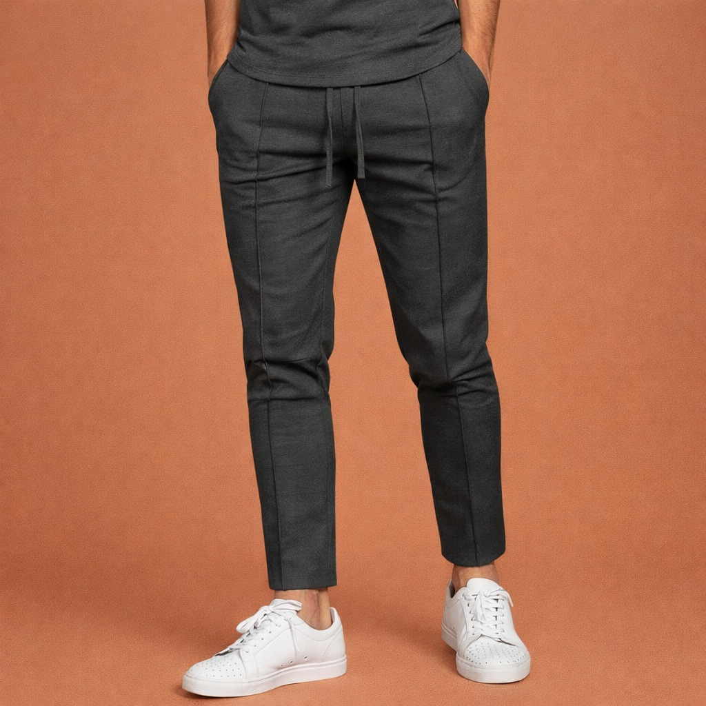 Dames broek in donkergrijs met minimalistisch design, zacht en comfortabel voor casual en stijlvolle outfits.