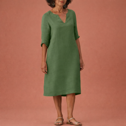 Dames midi zomerjurk in donkergroen met minimalistisch design, zacht en comfortabel voor casual en stijlvolle outfits.