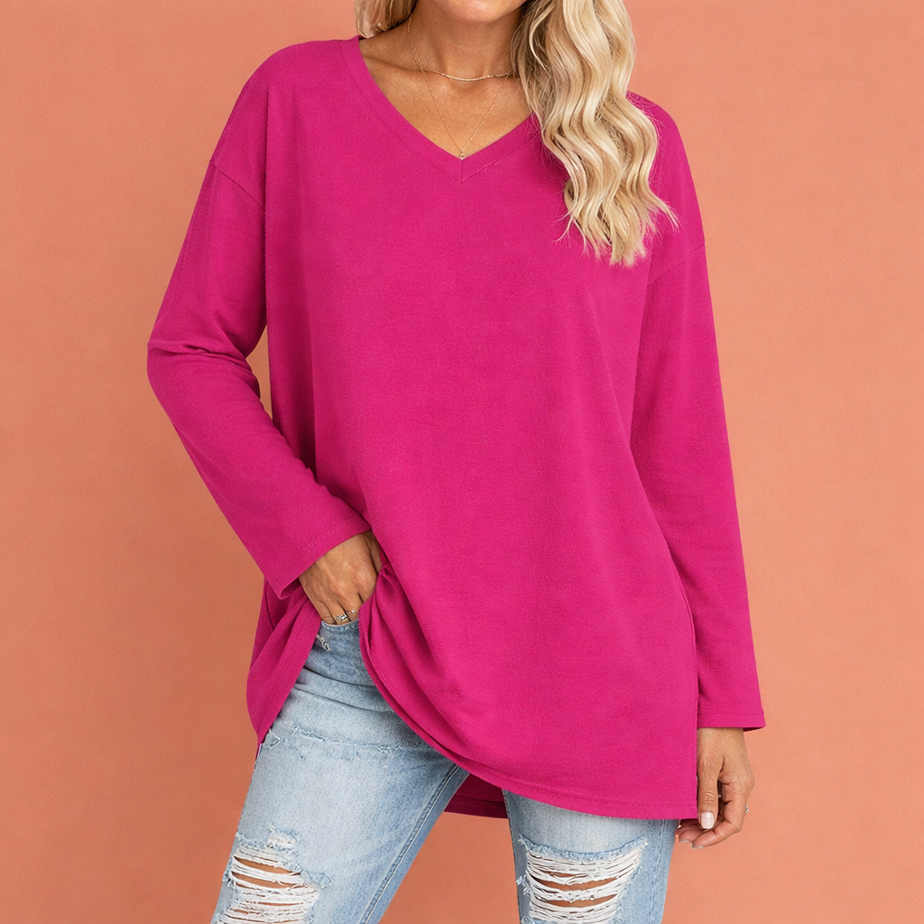 Dames tuniek in felroze met minimalistisch design, zacht en comfortabel voor casual en stijlvolle outfits.
