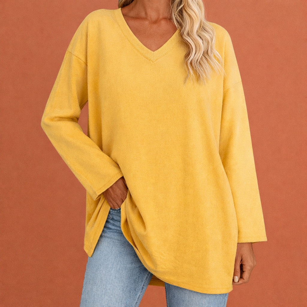 Dames tuniek in geel met minimalistisch design, zacht en comfortabel voor casual en stijlvolle outfits.