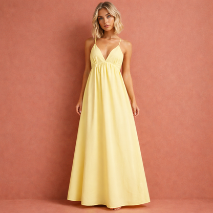 Gele rugloze maxi-jurk voor dames met cut-out ontwerp, perfect voor zomerse gelegenheden en vakanties.