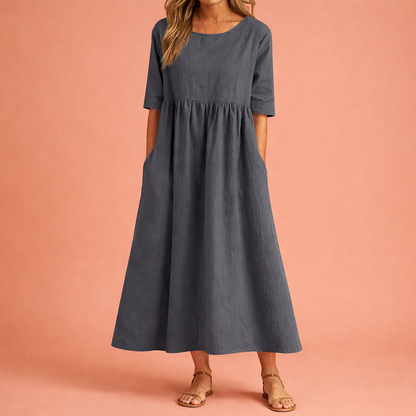 Dames maxi jurk in grijs met minimalistisch design, zacht en comfortabel voor casual en stijlvolle outfits.