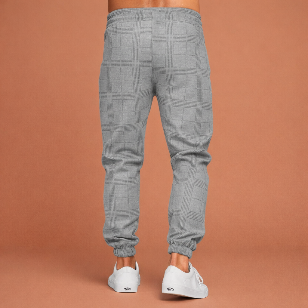 Heren joggingbroek in grijs met minimalistisch design, zacht en comfortabel voor casual en stijlvolle outfits.