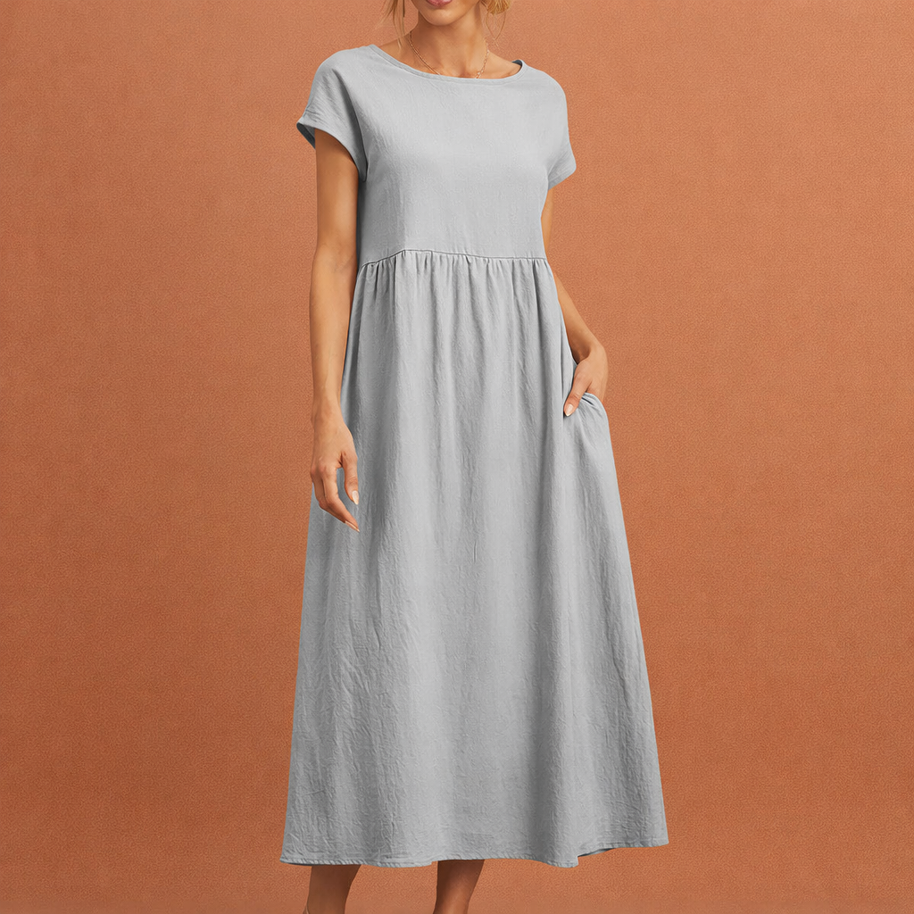 Dames midi jurk in grijs met minimalistisch design, zacht en comfortabel voor casual en stijlvolle outfits.