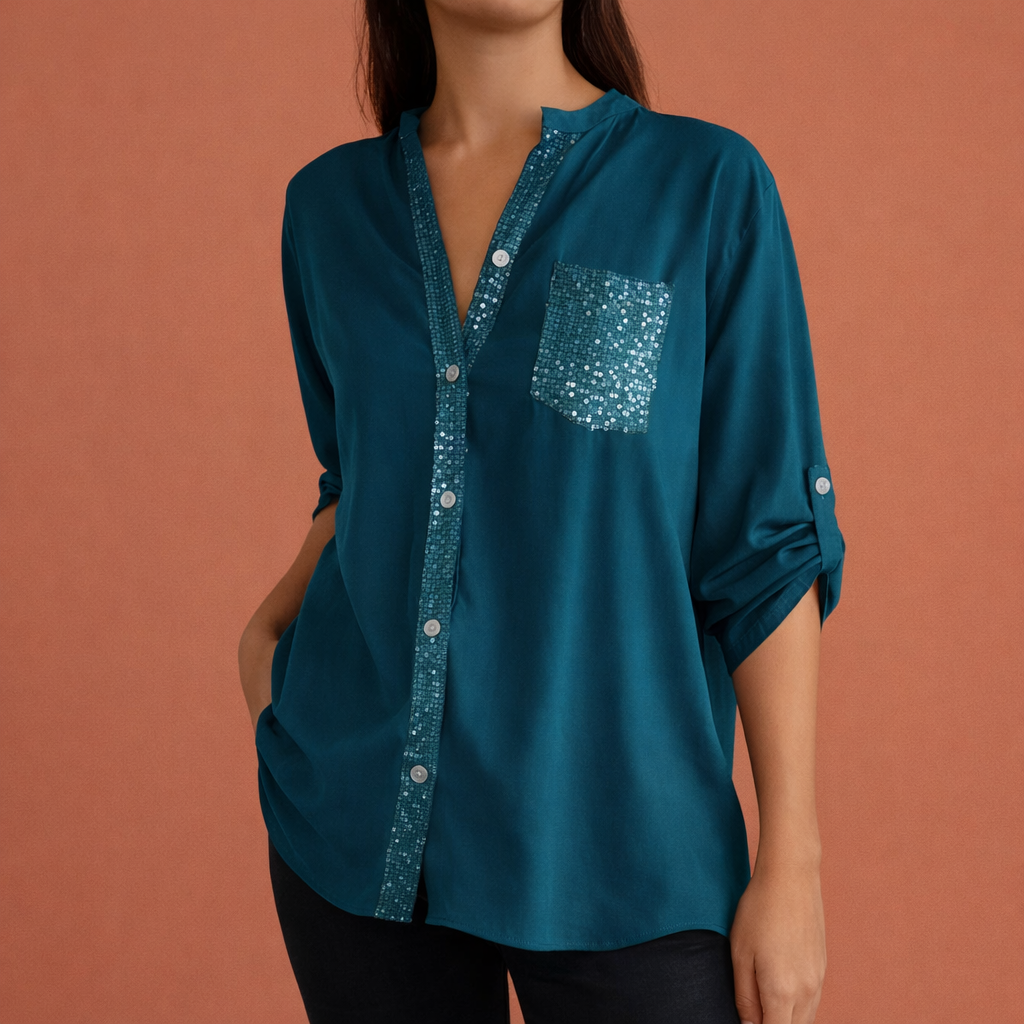 Dames blouse in groen met paillettenzak, zacht en comfortabel voor casual en stijlvolle outfits.
