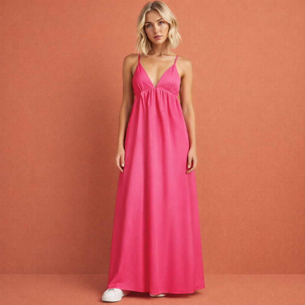 Heet roze rugloze maxi-jurk voor dames met cut-out ontwerp, perfect voor zomerse gelegenheden en vakanties.