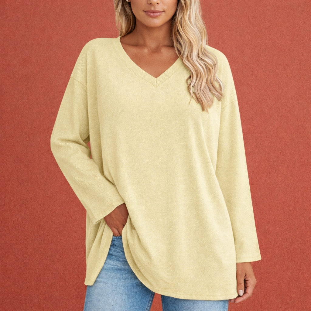 Dames tuniek in lichtgeel met minimalistisch design, zacht en comfortabel voor casual en stijlvolle outfits.