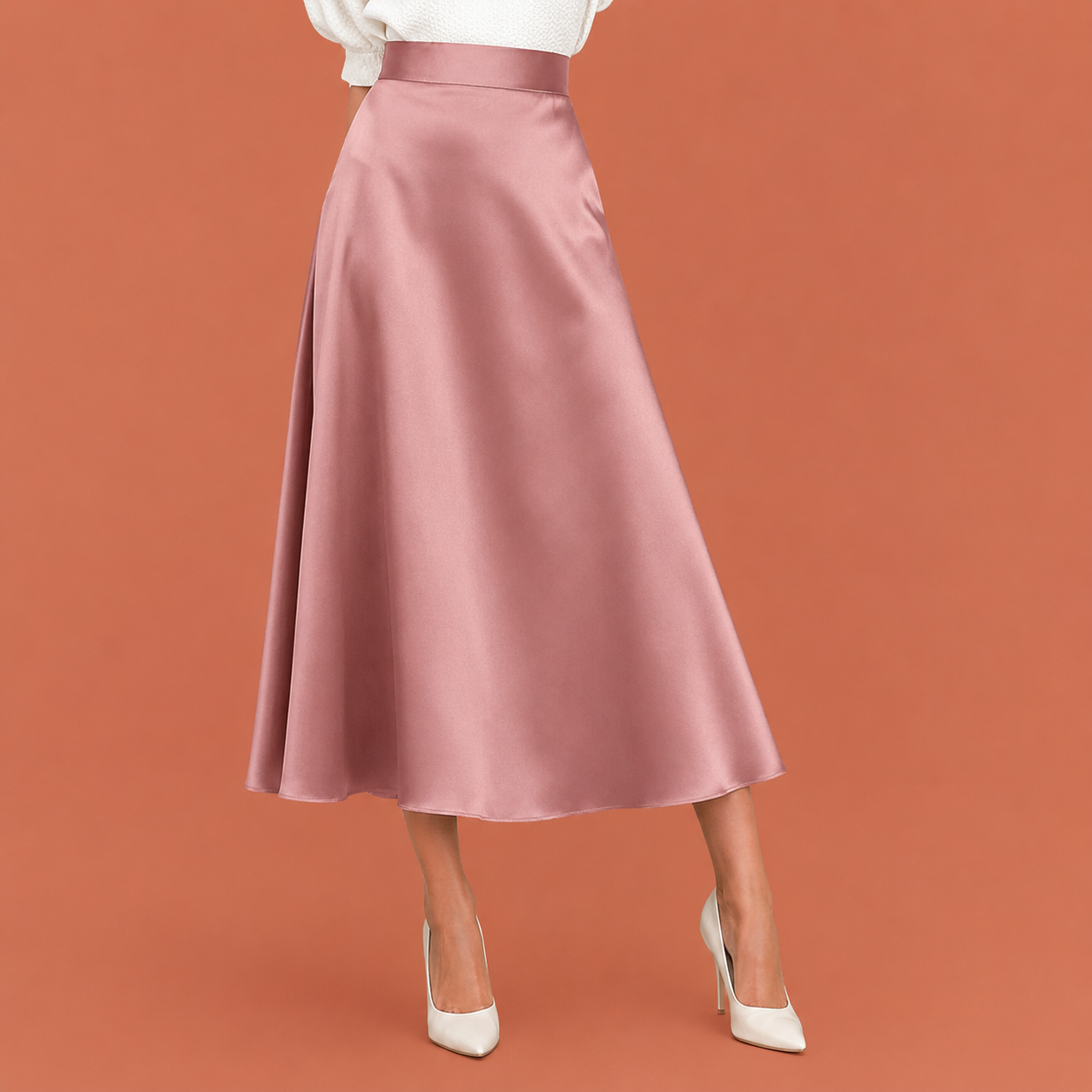 Dames midi rok in lichtroze met minimalistisch design, zacht en comfortabel voor casual en stijlvolle outfits.
