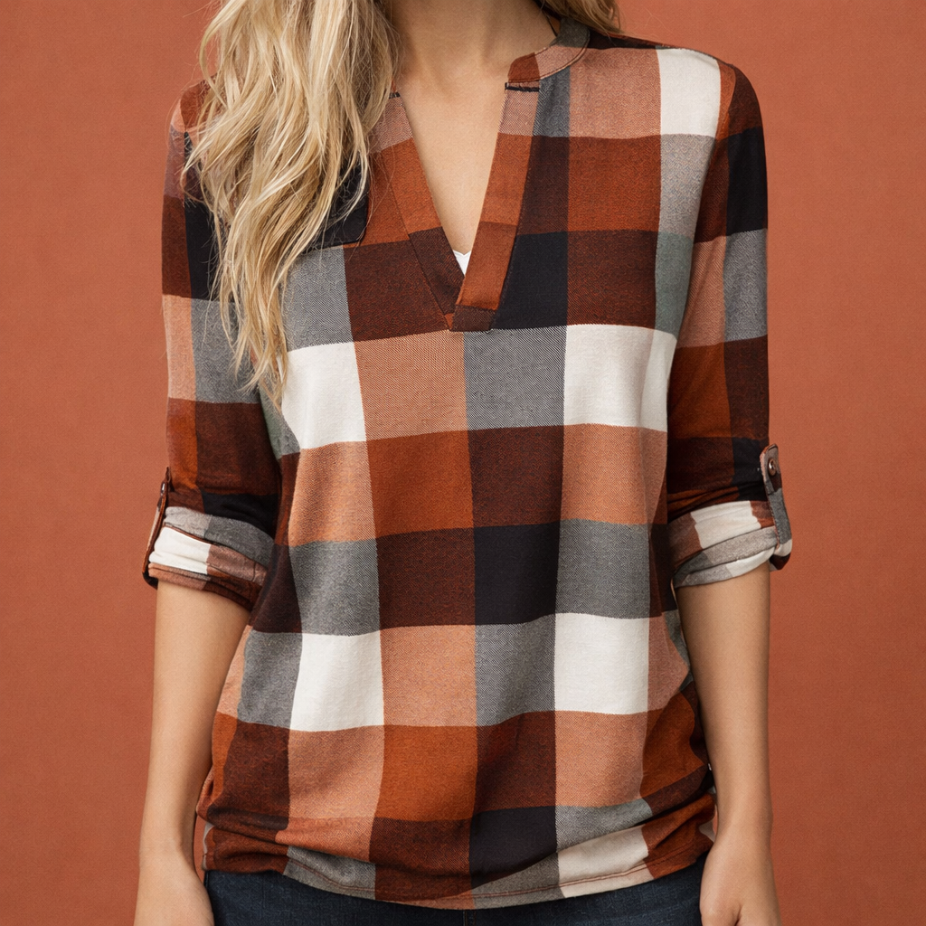 Dames blouse in oranje met minimalistisch design, zacht en comfortabel voor casual en stijlvolle outfits.