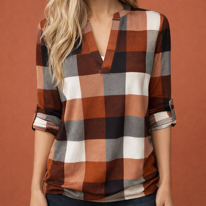 Dames blouse in oranje met minimalistisch design, zacht en comfortabel voor casual en stijlvolle outfits.