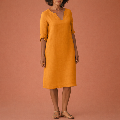 Dames midi zomerjurk in oranje met minimalistisch design, zacht en comfortabel voor casual en stijlvolle outfits.