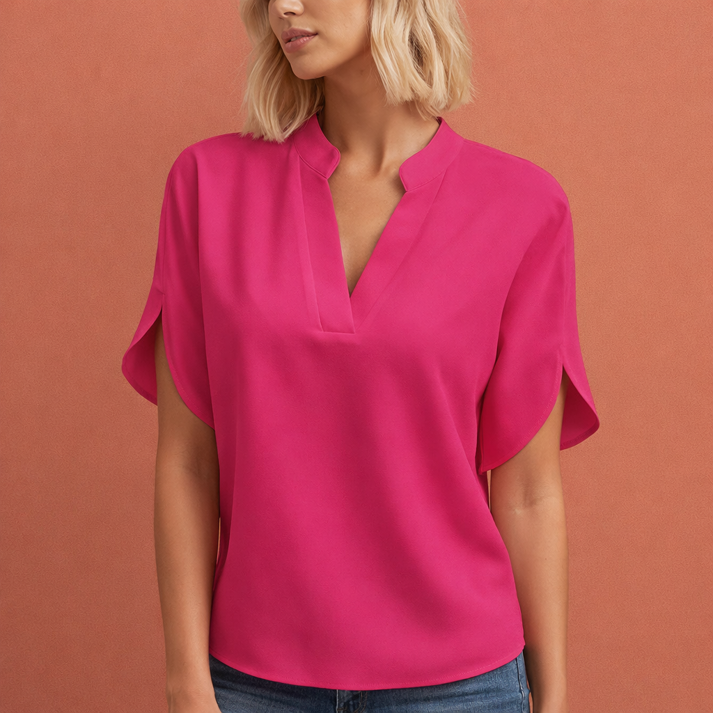 Dames blouse in roze met minimalistisch design, zacht en comfortabel voor casual en stijlvolle outfits.