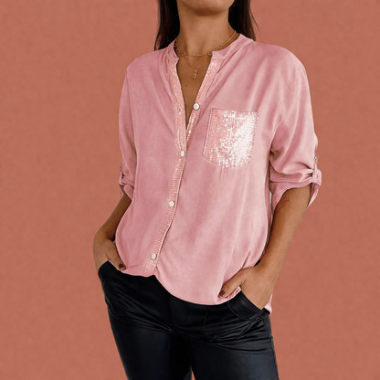 Dames blouse in roze met paillettenzak, zacht en comfortabel voor casual en stijlvolle outfits.