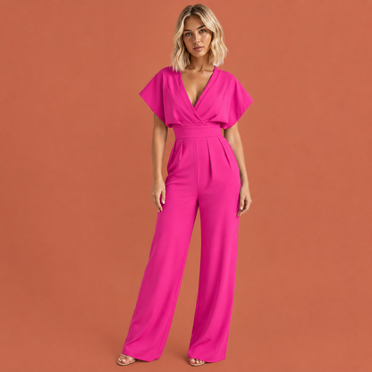 Dames jumpsuit in roze met ruchemouwen, zacht en comfortabel voor casual en stijlvolle outfits.