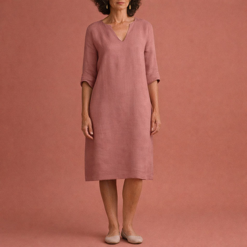 Dames midi zomerjurk in roze met minimalistisch design, zacht en comfortabel voor casual en stijlvolle outfits.