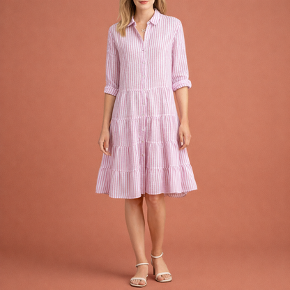 Dames midi zomerjurk in roze met minimalistisch design, zacht en comfortabel voor casual en stijlvolle outfits.