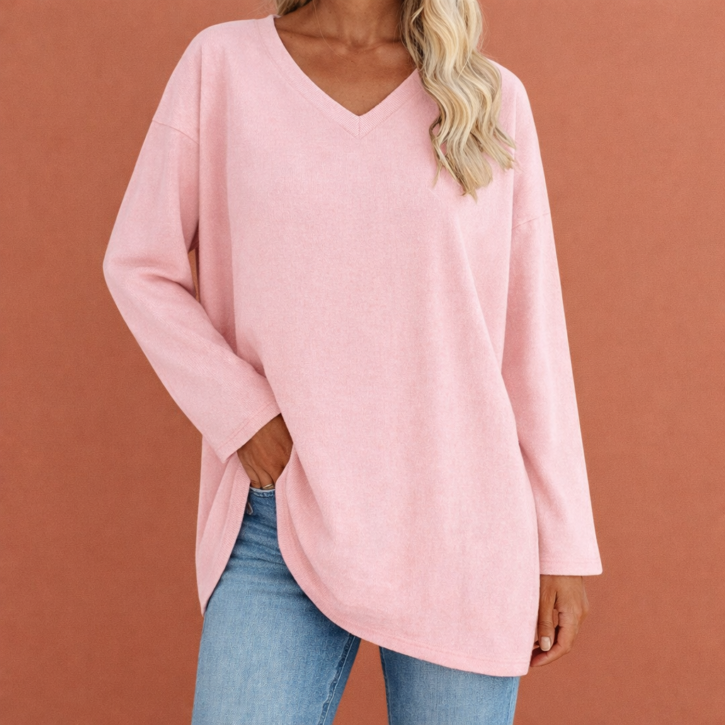 Dames tuniek in roze met minimalistisch design, zacht en comfortabel voor casual en stijlvolle outfits.