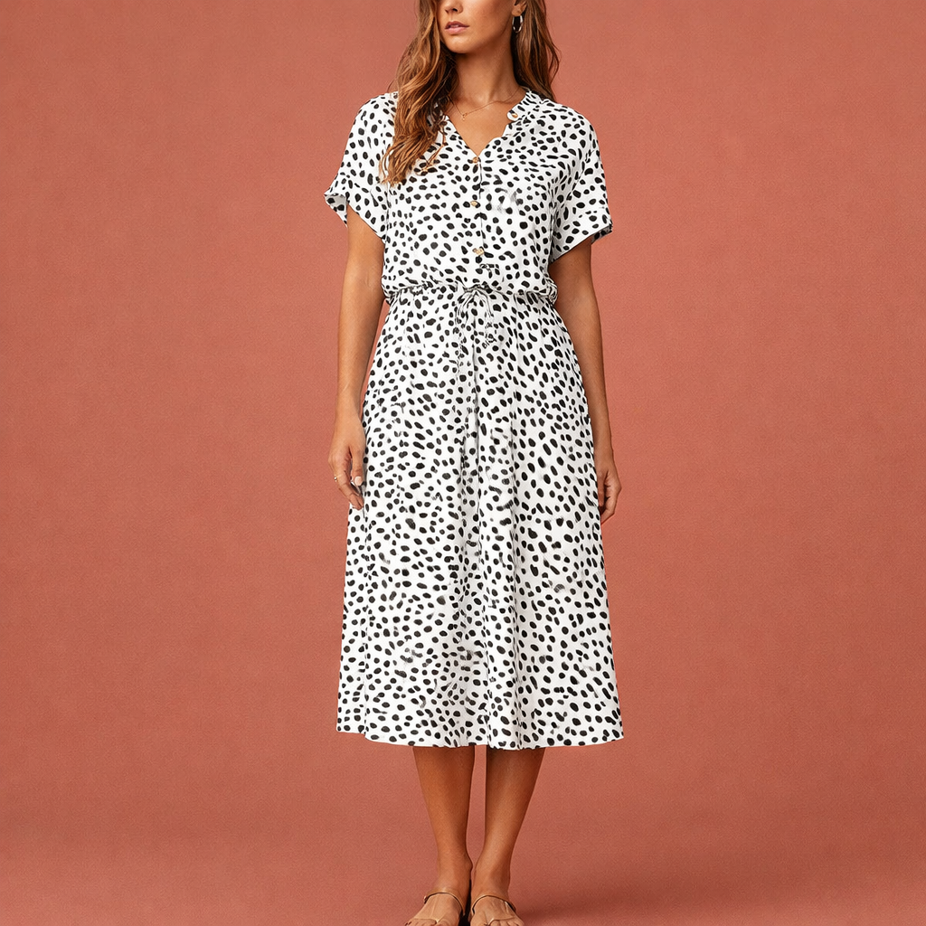 Dames midi jurk in wit met minimalistisch design, zacht en comfortabel voor casual en stijlvolle outfits.