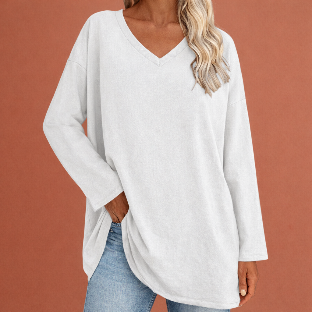 Dames tuniek in wit met minimalistisch design, zacht en comfortabel voor casual en stijlvolle outfits.