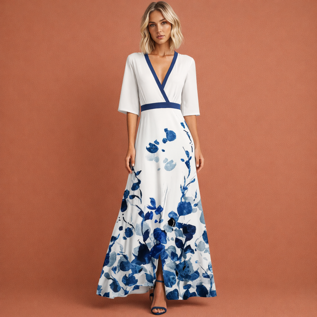 Witte lange damesjurk met bloemenprint en V-hals, perfect voor zomerse dagen en feestelijke gelegenheden.