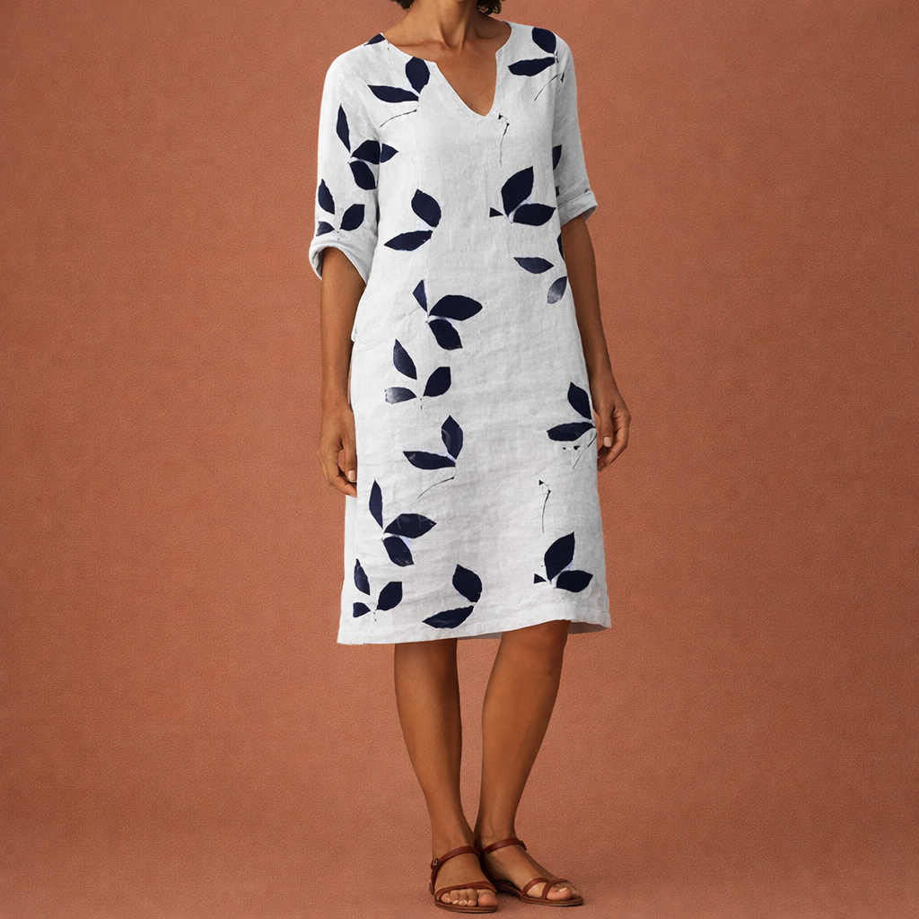 Dames midi jurk in wit met bladerenprint, luchtig en comfortabel voor casual en stijlvolle zomeroutfits.