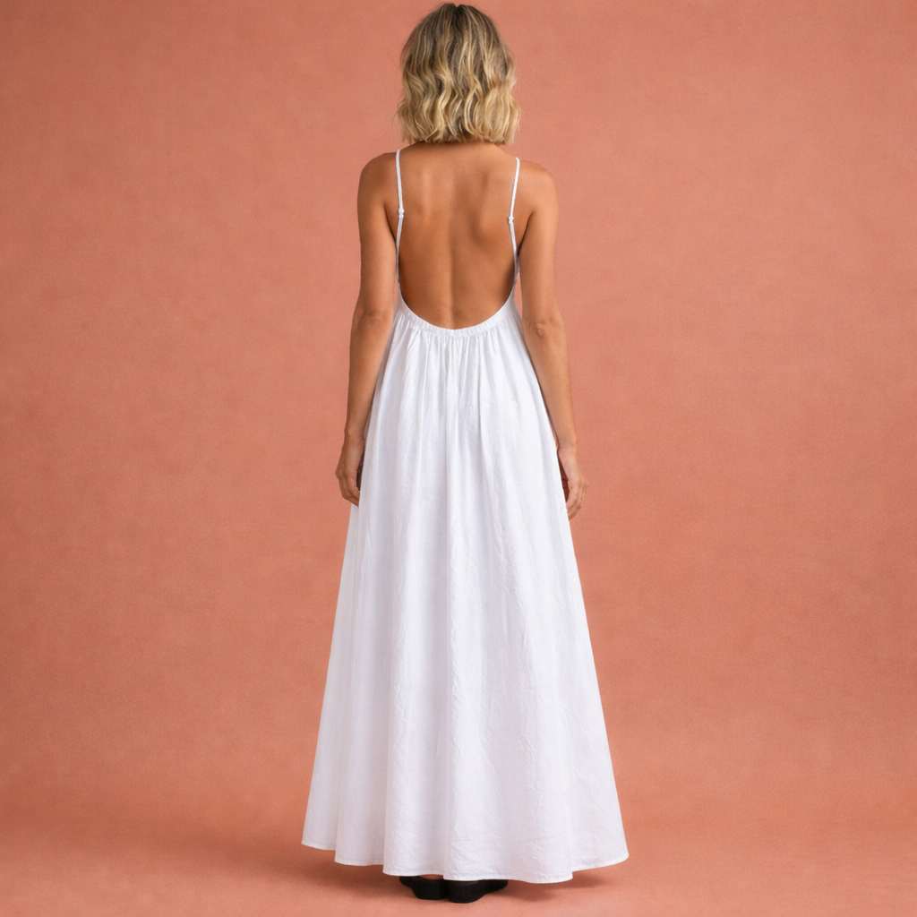 Witte rugloze maxi-jurk voor dames met cut-out ontwerp, perfect voor zomerse gelegenheden en vakanties.1