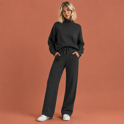 Dames joggingpak in zwart met minimalistisch design, zacht en comfortabel voor casual en stijlvolle outfits.