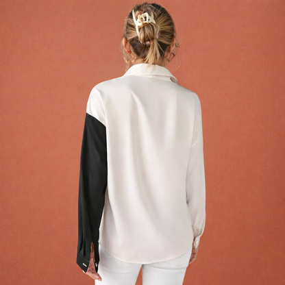 Dames blouse in zwart met minimalistisch design, zacht en comfortabel voor casual en stijlvolle outfits.