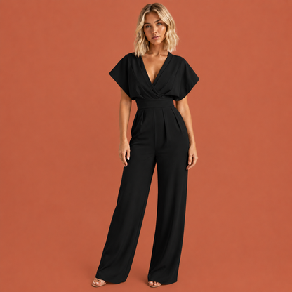 Dames jumpsuit in zwart met ruchemouwen, zacht en comfortabel voor casual en stijlvolle outfits.