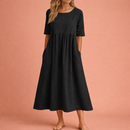 Dames maxi jurk in zwart met minimalistisch design, zacht en comfortabel voor casual en stijlvolle outfits.