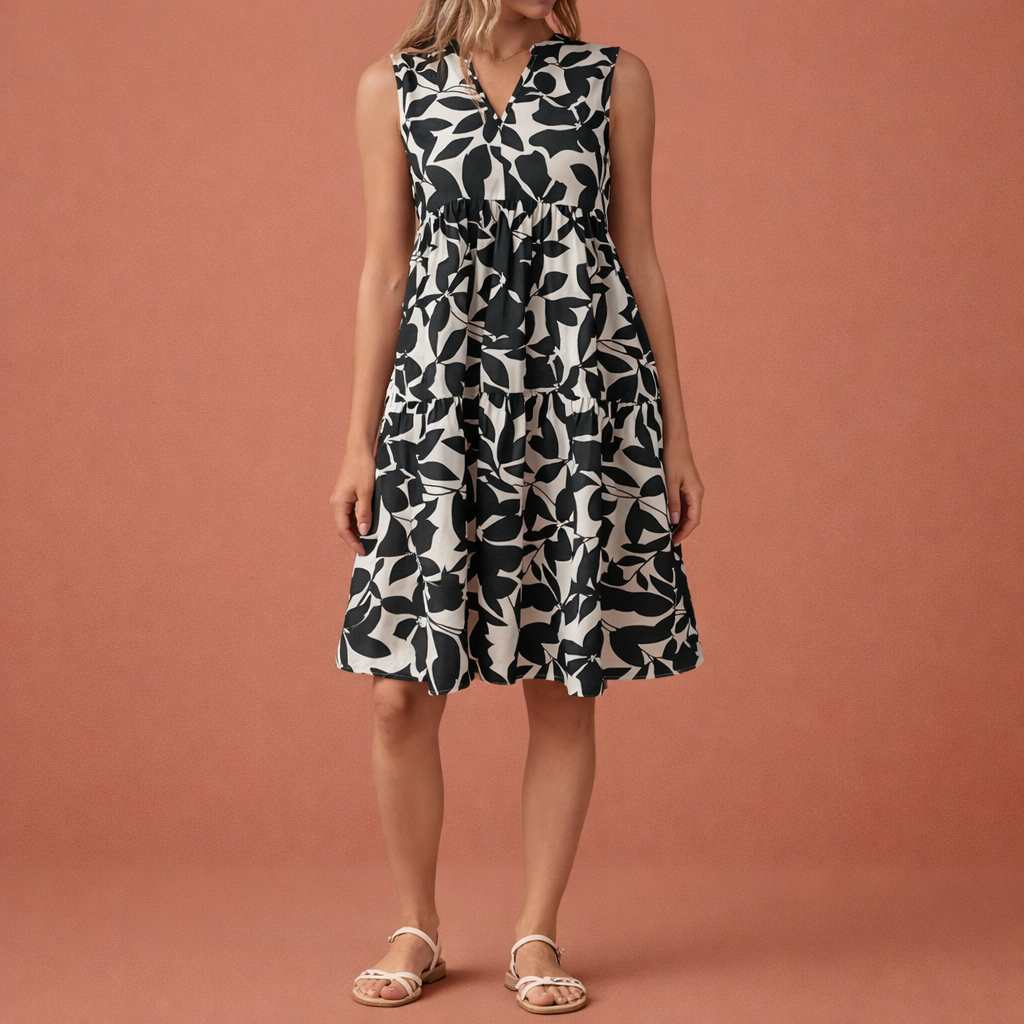 Dames midi zomerjurk in zwart met minimalistisch design, zacht en comfortabel voor casual en stijlvolle outfits.