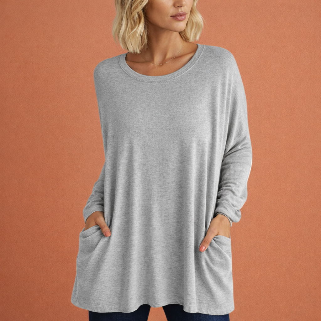 Dames oversized tuniek in zwart met minimalistisch design, zacht en comfortabel voor casual en stijlvolle outfits.