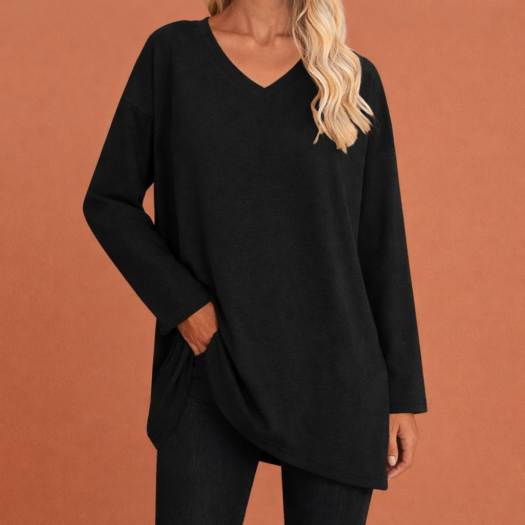 Dames tuniek in zwart met minimalistisch design, zacht en comfortabel voor casual en stijlvolle outfits.