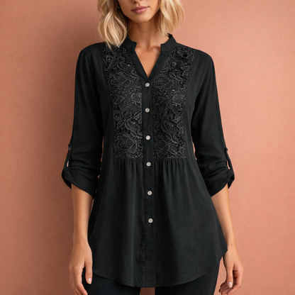 Dames tuniekblouse in zwart met minimalistisch design, zacht en comfortabel voor casual en stijlvolle outfits.