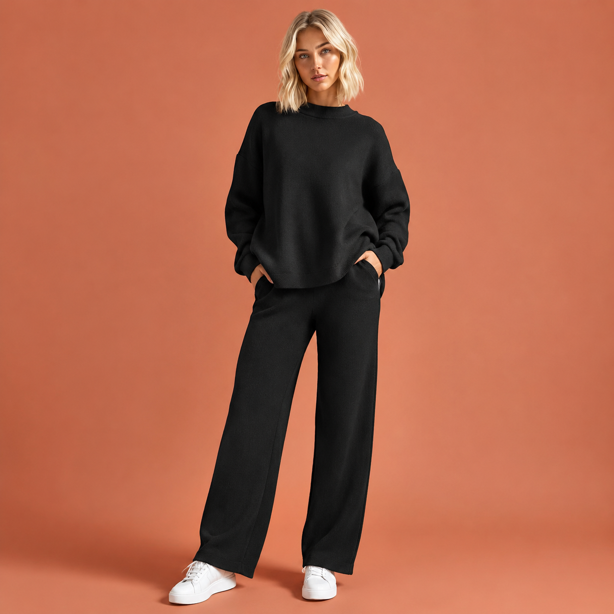 Dames gebreide damesset in zwart met minimalistisch design, zacht en comfortabel voor casual en stijlvolle outfits.