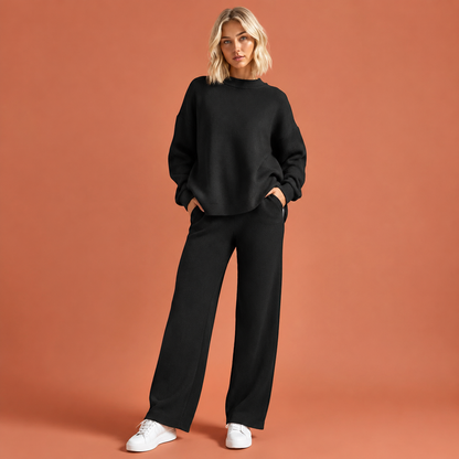 Dames gebreide damesset in zwart met minimalistisch design, zacht en comfortabel voor casual en stijlvolle outfits.