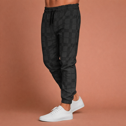 Heren joggingbroek in zwart met minimalistisch design, zacht en comfortabel voor casual en stijlvolle outfits.